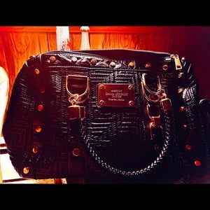 Gianni Versace black purse . Pre used . Like new